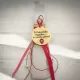 Handmade Easter candle with engraved wooden message for godfather and elegant red ribbon decoration