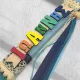 Handmade light blue Easter candle with personalized wooden name decoration and elegant embellishments