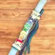 Handmade light blue Easter candle with personalized wooden name decoration and elegant embellishments