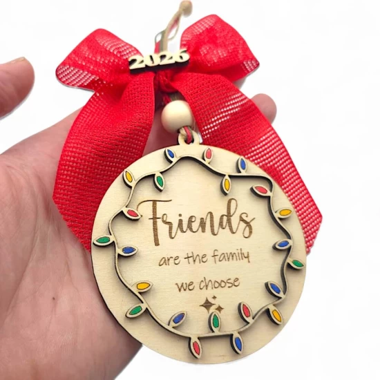 handmade wooden Friends 2026 Christmas ornament with red ribbon