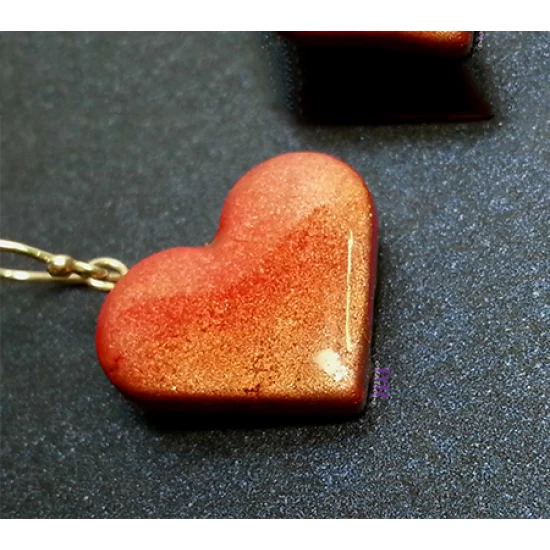Handmade metallic heart earrings.