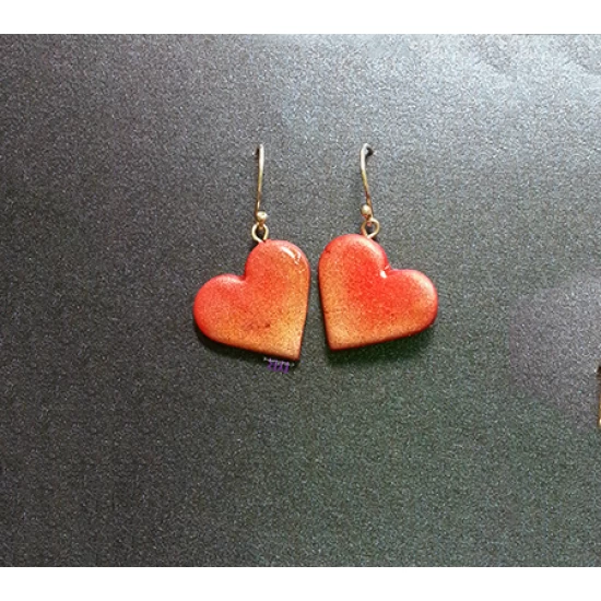 Handmade metallic heart earrings.