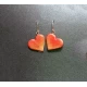 Handmade metallic heart earrings.