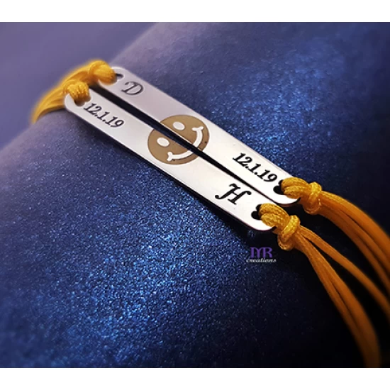 Silver identity bracelets with smile design and enamel.