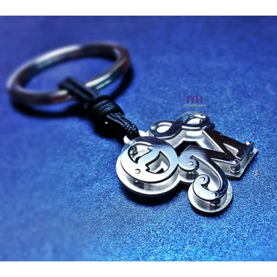 Silver key ring with two calligraphic monograms of your choice.