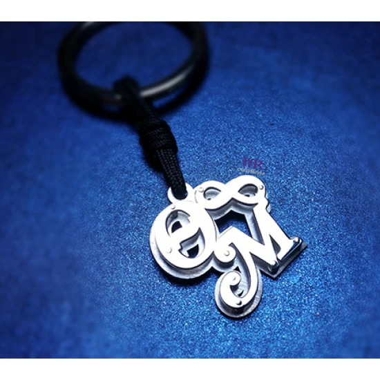 Silver key ring with two calligraphic monograms of your choice.