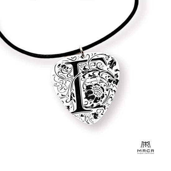 Silver guitar nib pendant with an initial of your choice engraved