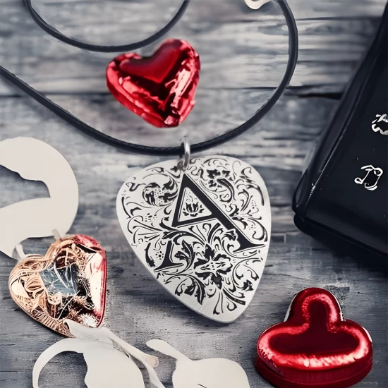 Silver guitar nib pendant with an initial of your choice engraved