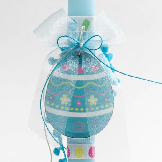 Easter candle with blue candle and blue wooden egg
